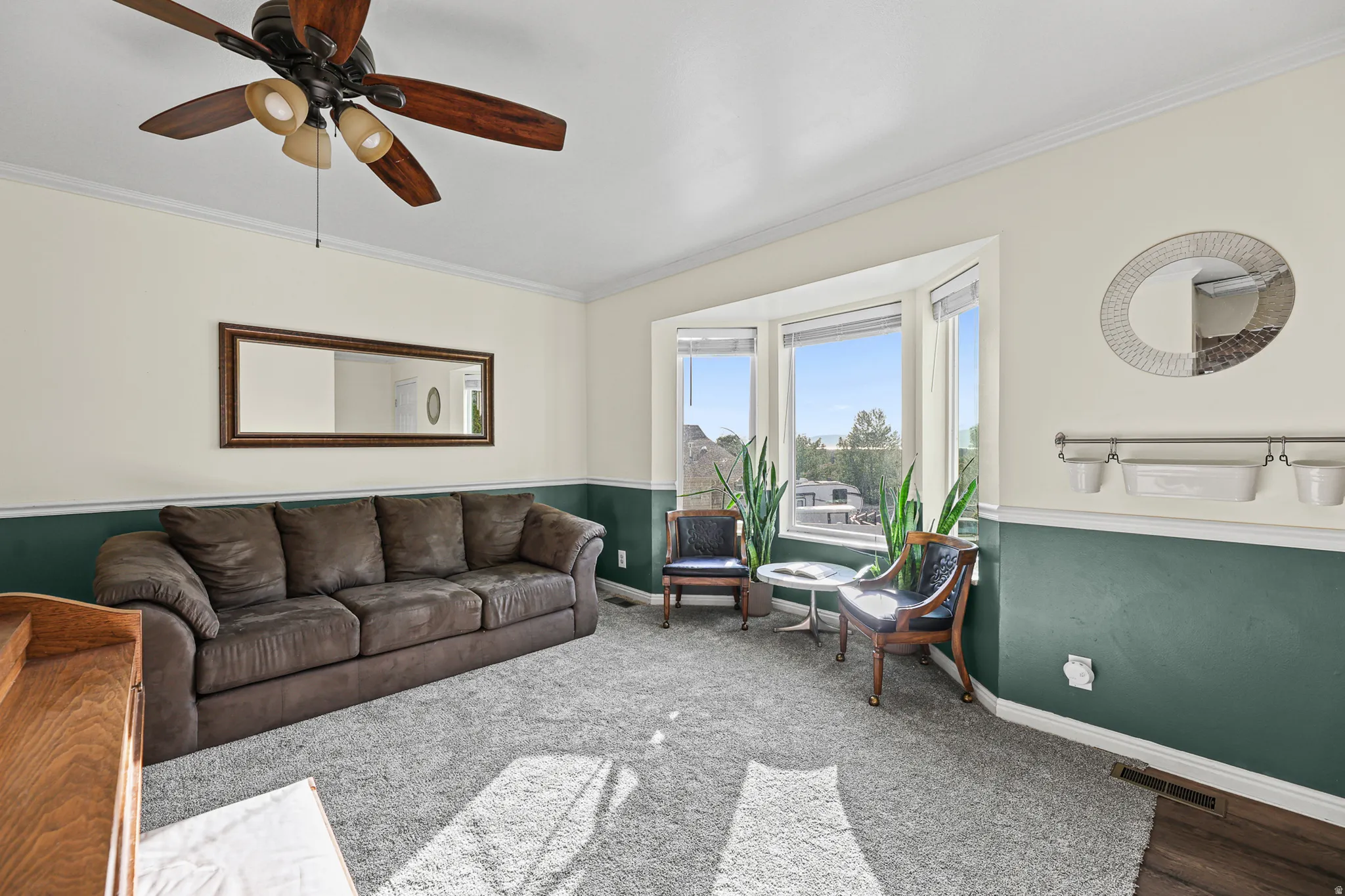 Living room with brand new carpet and bay window