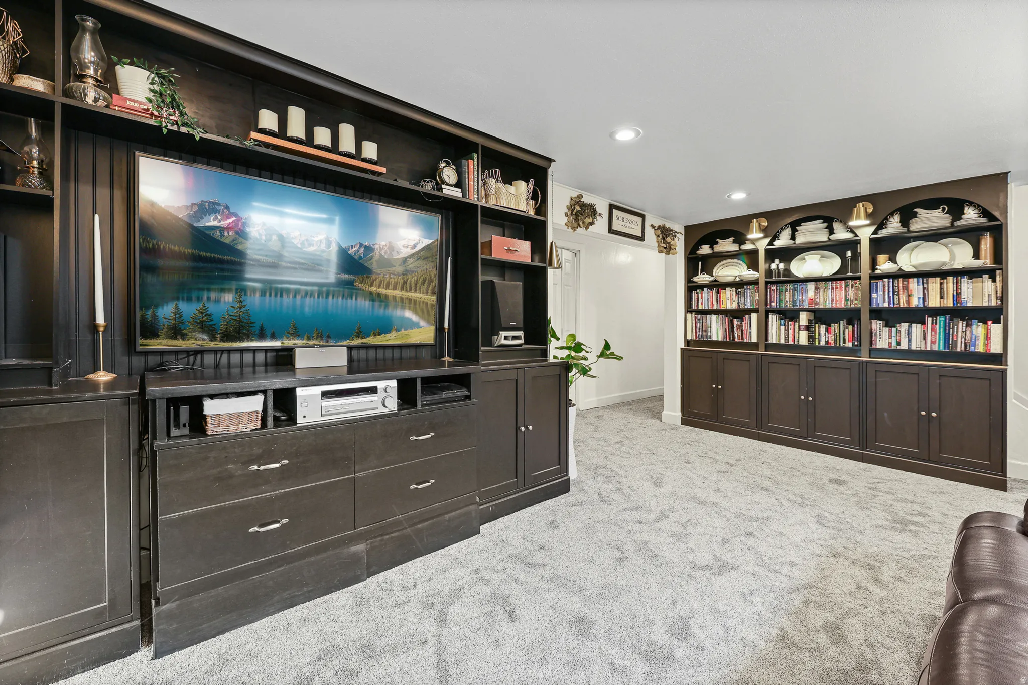Custom built-in media center and built-in wall unit. New carpet