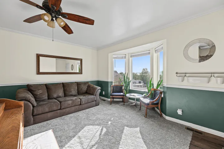 Living room with brand new carpet and bay window