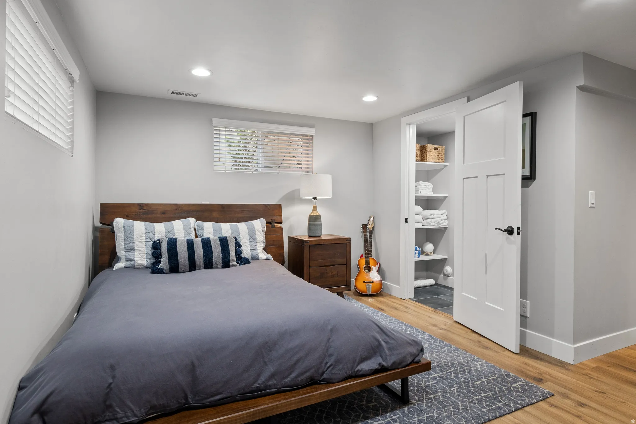 Wood-finish flooring with a contrasting area rug