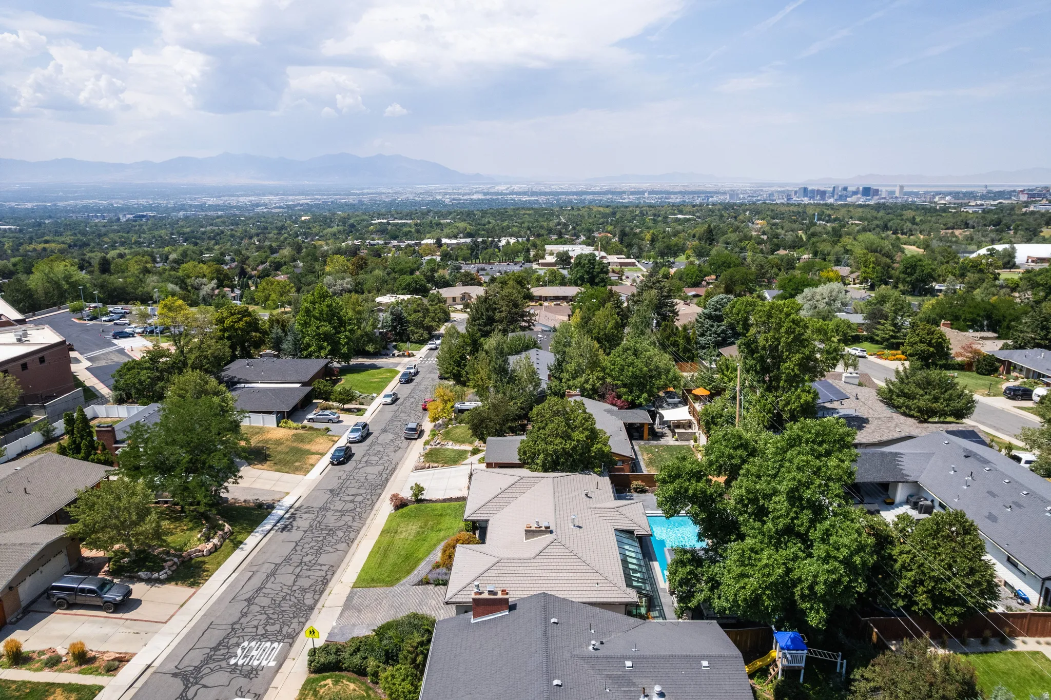 Expansive neighborhood with abundant mature trees and distant city skyline