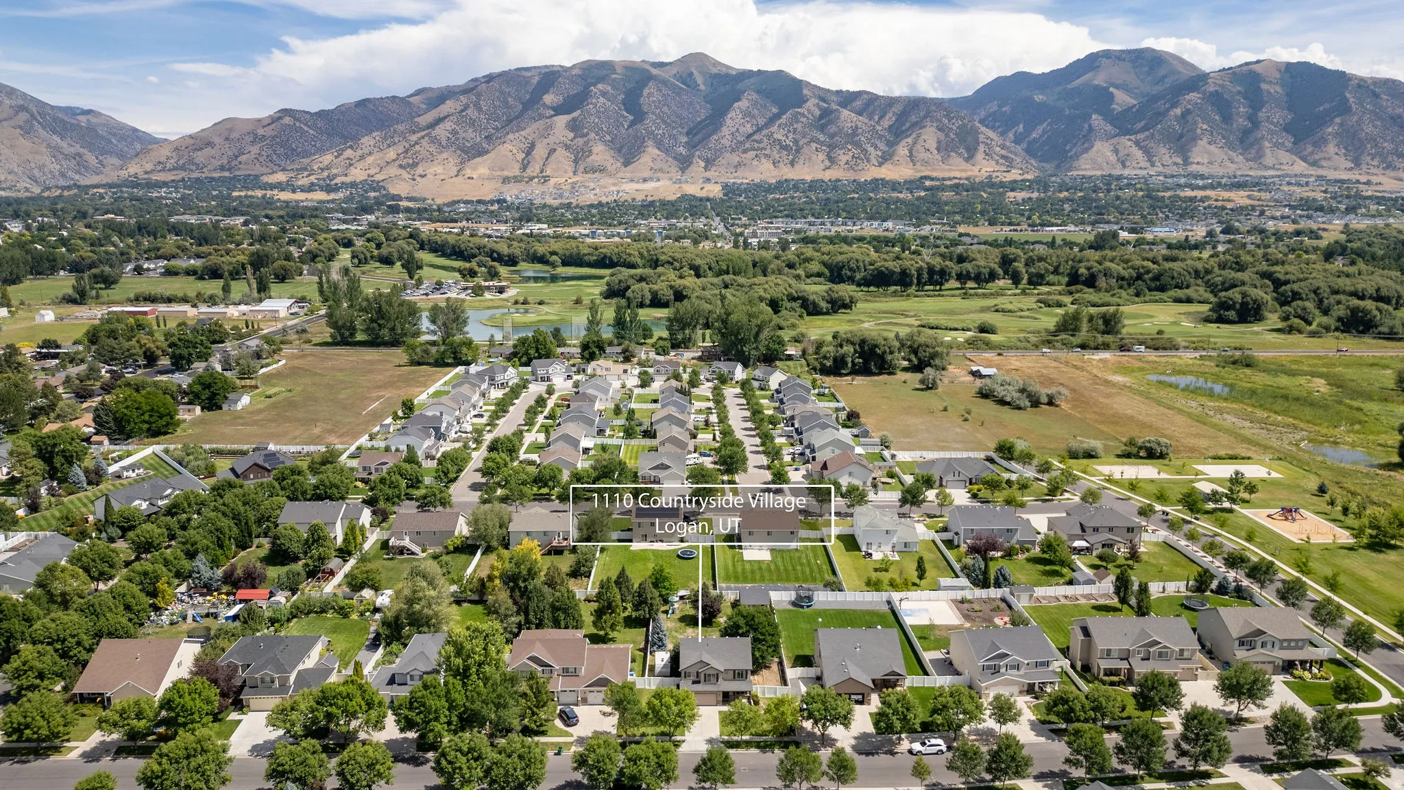 Aerial perspective showcasing an established residential development with natural scenery and mountain backdrop