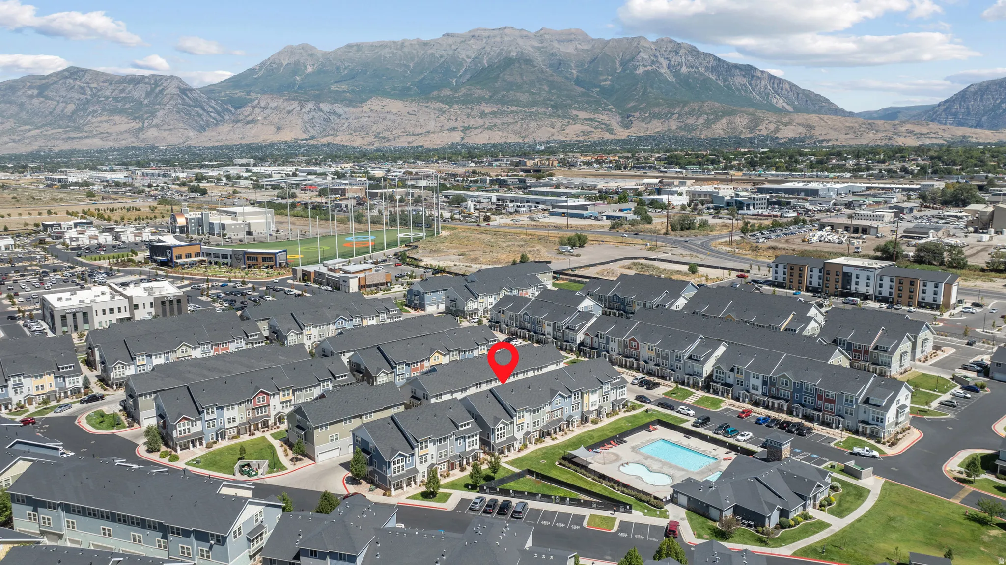 Mountain backdrop and surrounding commercial amenities