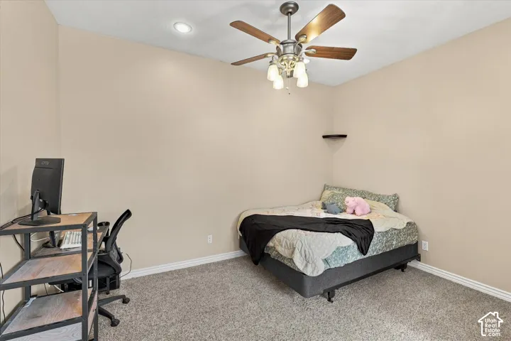 Neutral wall tones, recessed lighting, ceiling fan with light kit, and carpeted flooring