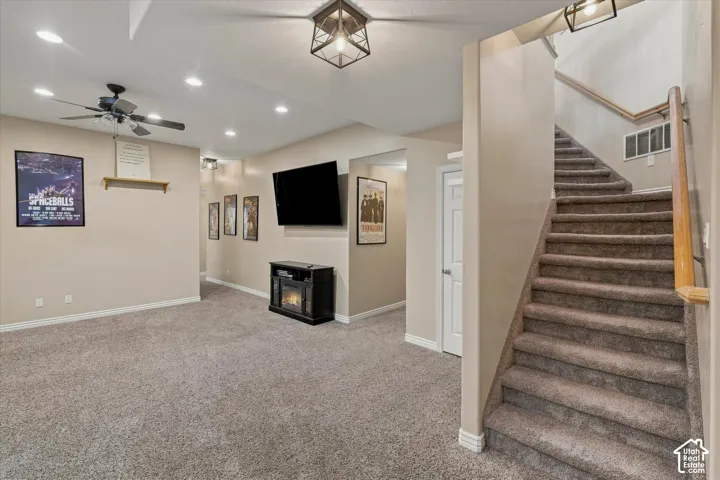 Carpeted flooring, recessed lighting, and a ceiling fan