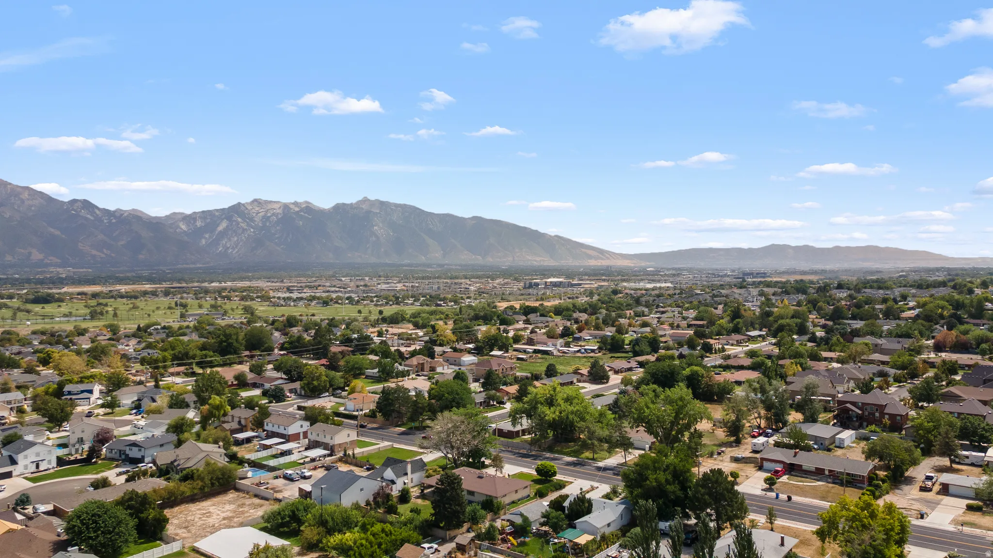 Expansive mountain range backdrop and a developed neighborhood setting