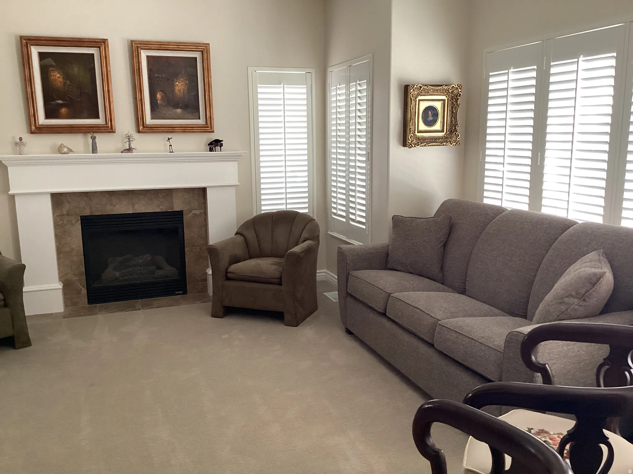 Gas fireplace with a tile surround and substantial mantel