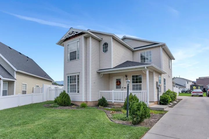 Two-story exterior with light-colored siding