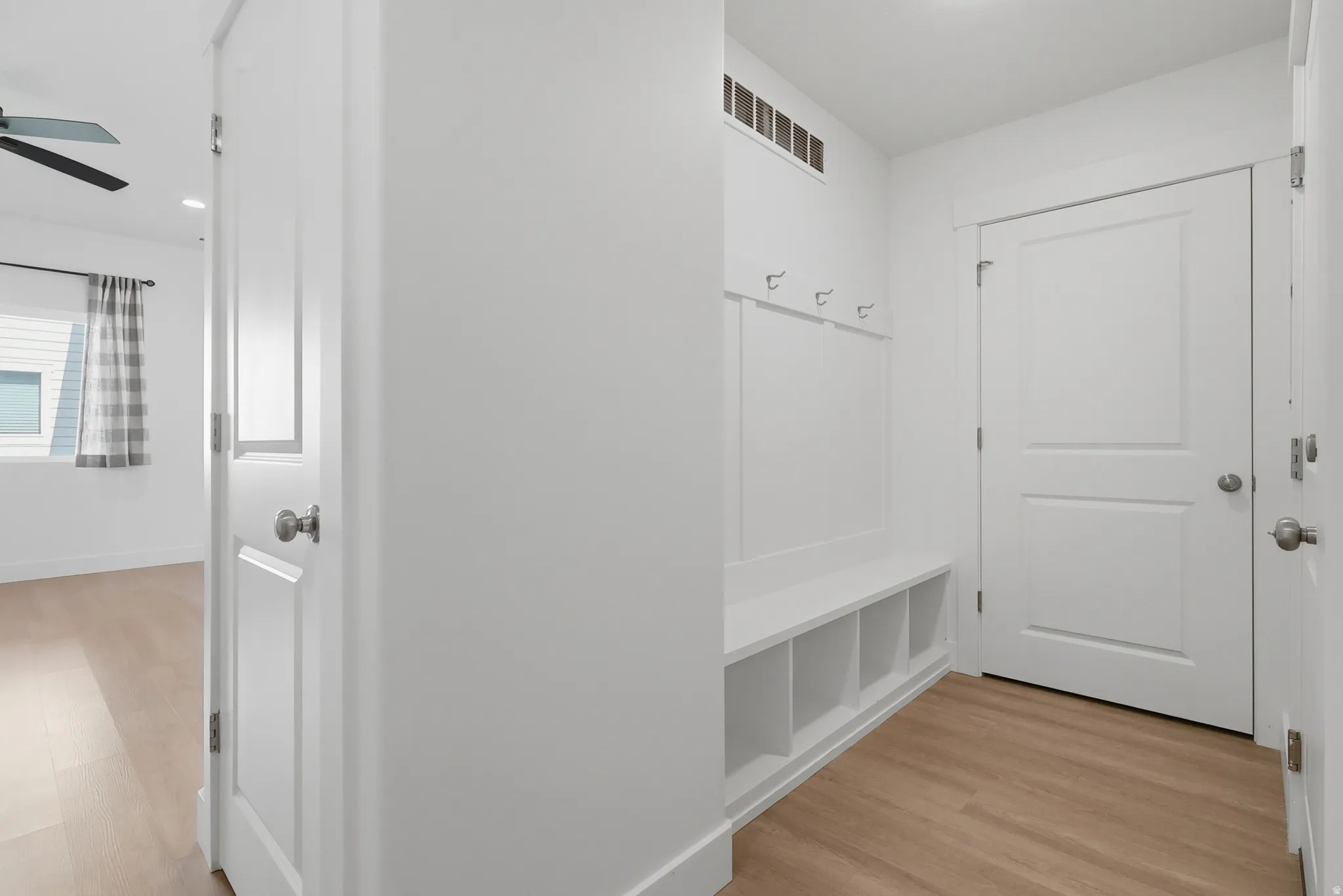 Built-in hall tree with storage cubbies and coat hooks