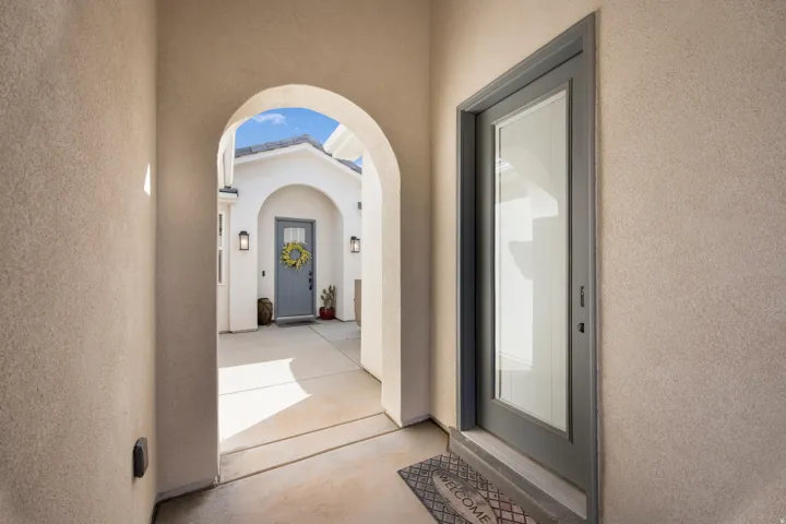 Archway entry with stucco finishes
