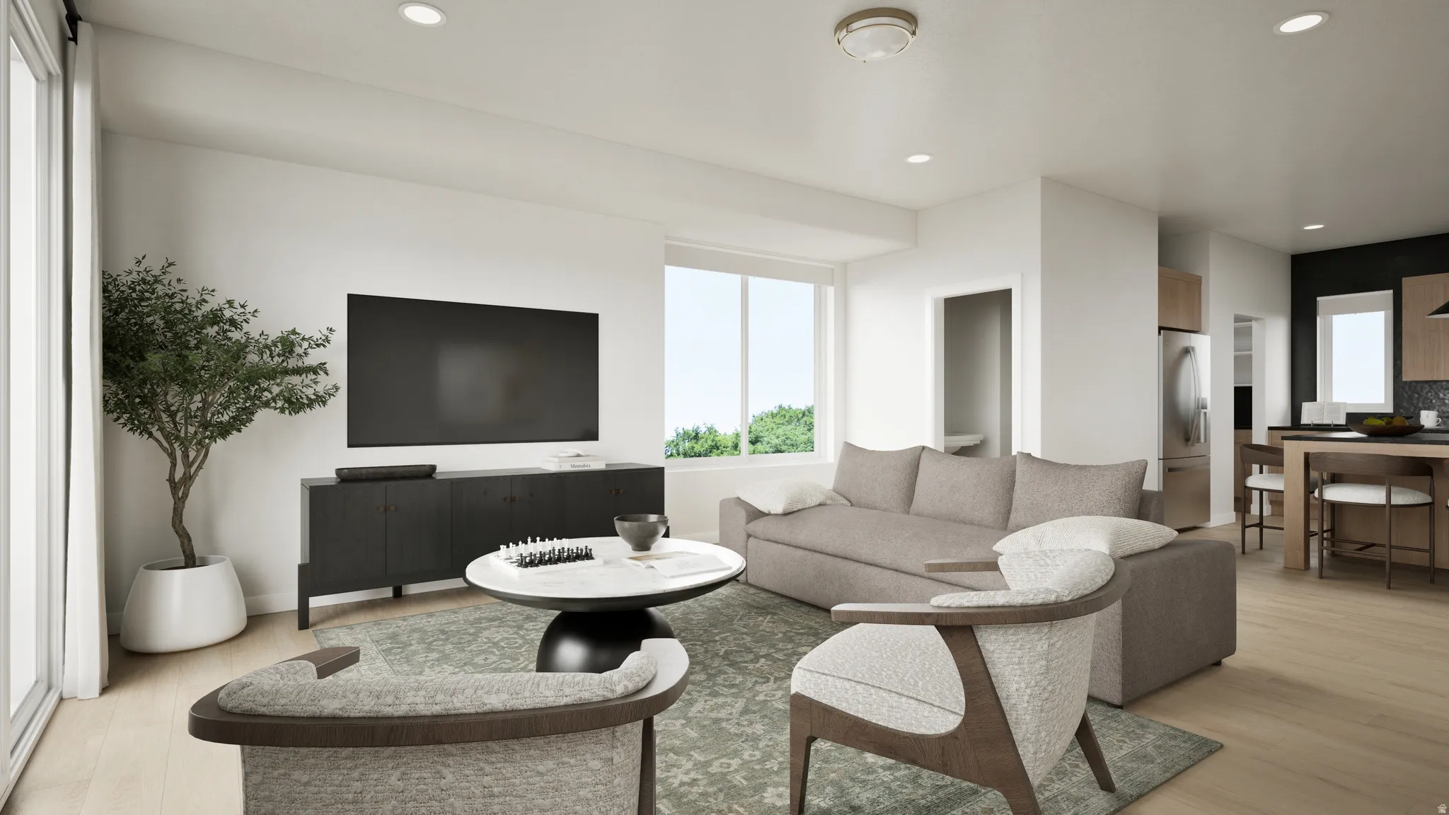 Open-concept living area with wood-finish flooring, recessed lighting, and large windows