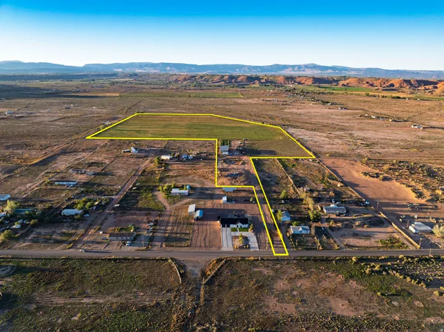 Expansive land parcel featuring cultivated fields and undeveloped acreage