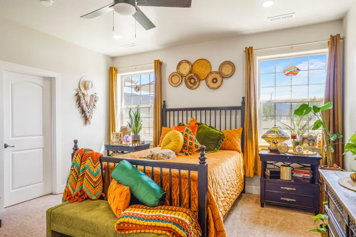 Carpeted flooring, ceiling fan with integrated lighting, recessed lighting, and two windows