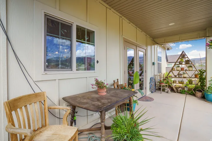 Covered patio with concrete flooring, recessed lighting, and a white paneled exterior