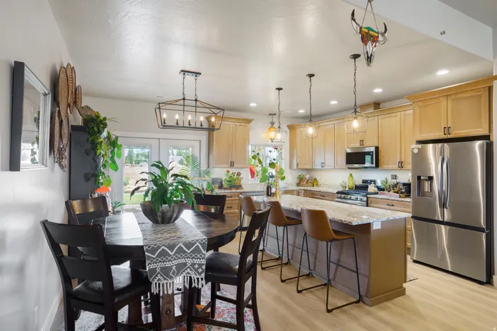 Kitchen featuring wood-finish flooring, recessed lighting, and stainless steel appliances