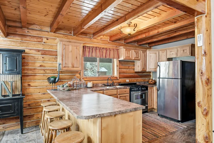 Wood-paneled walls and ceiling with exposed beams