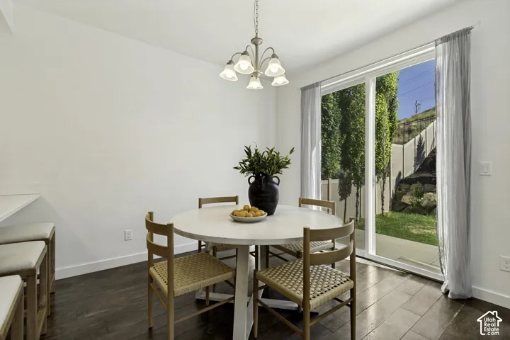 White walls with dark wood-finish flooring