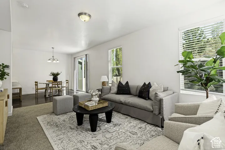 Recessed lighting, wood-finish flooring, and multiple windows with blinds