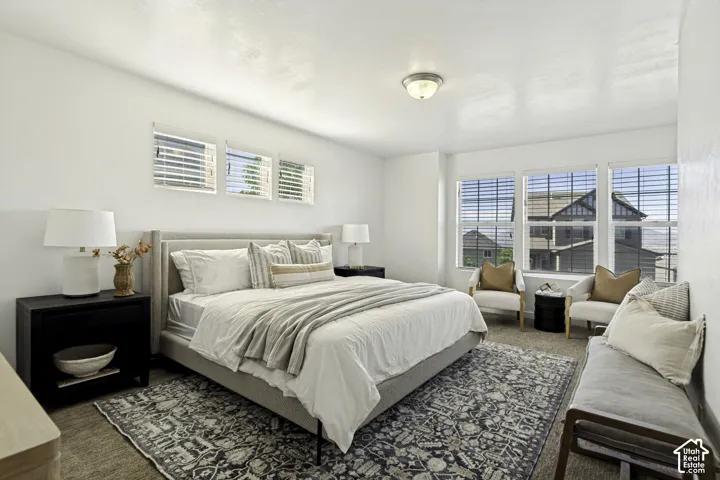 Wall-mounted flush dome light fixture, three rectangular windows with horizontal blinds, and three large windows with horizontal blinds