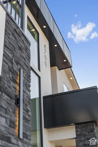 Modern exterior featuring stacked stone accents