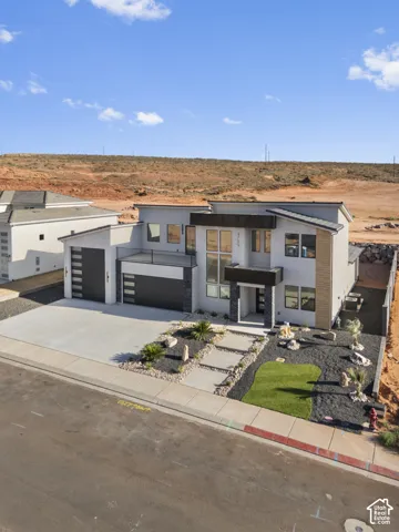 Modern two-story residence featuring a contemporary fa