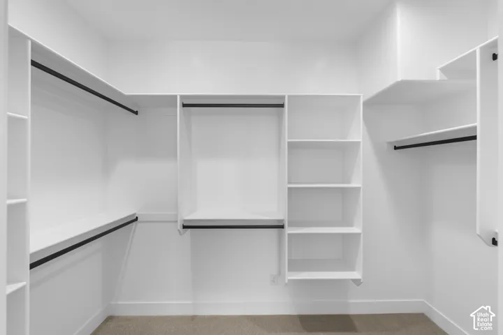 Built-in white shelving and hanging rods