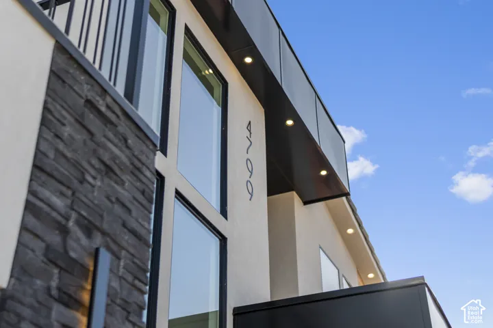 Stucco exterior with stone veneer accents