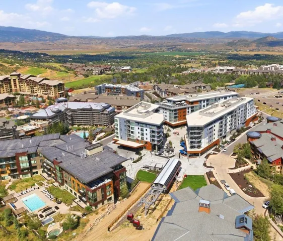 Expansive mountain valley setting with multiple resort-style buildings