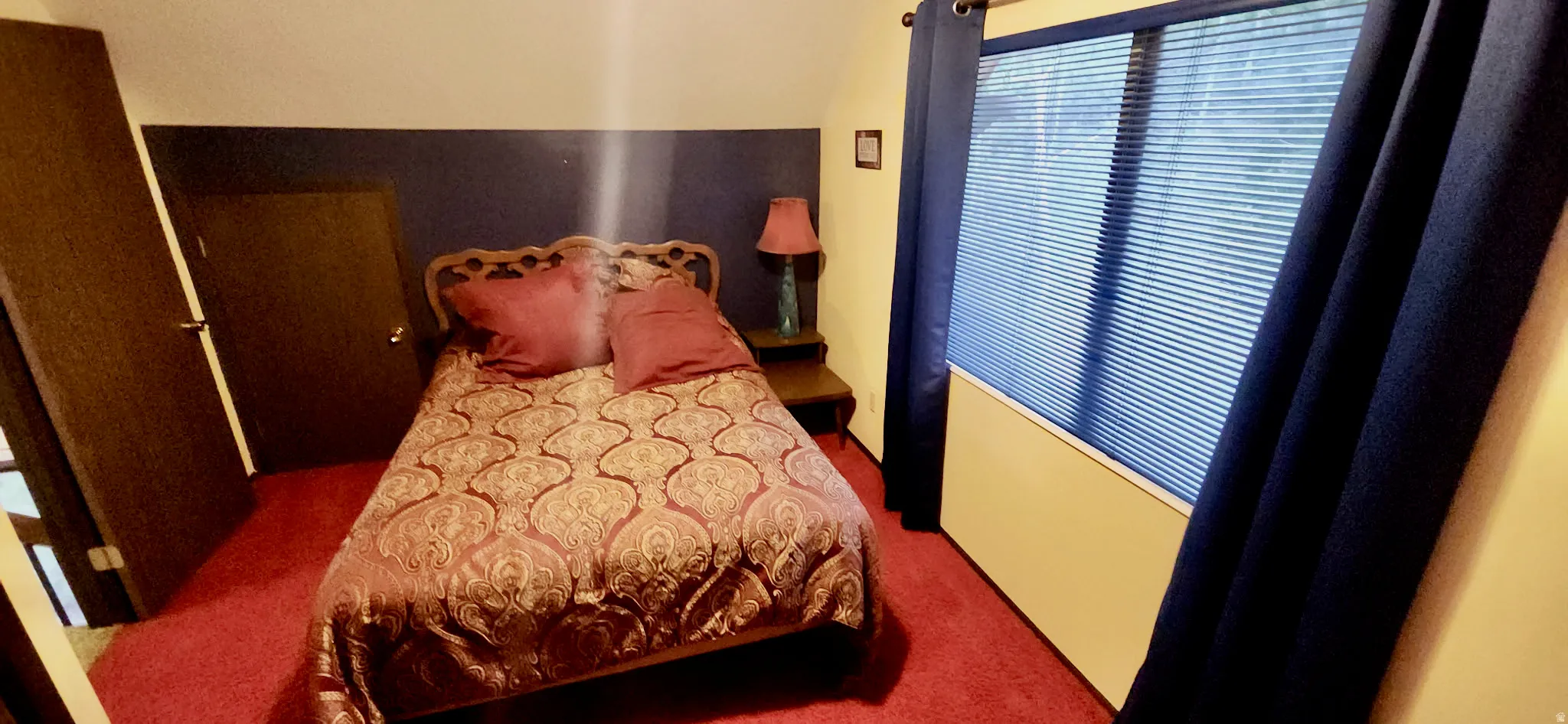 Spacious upstairs bedroom with additional storage