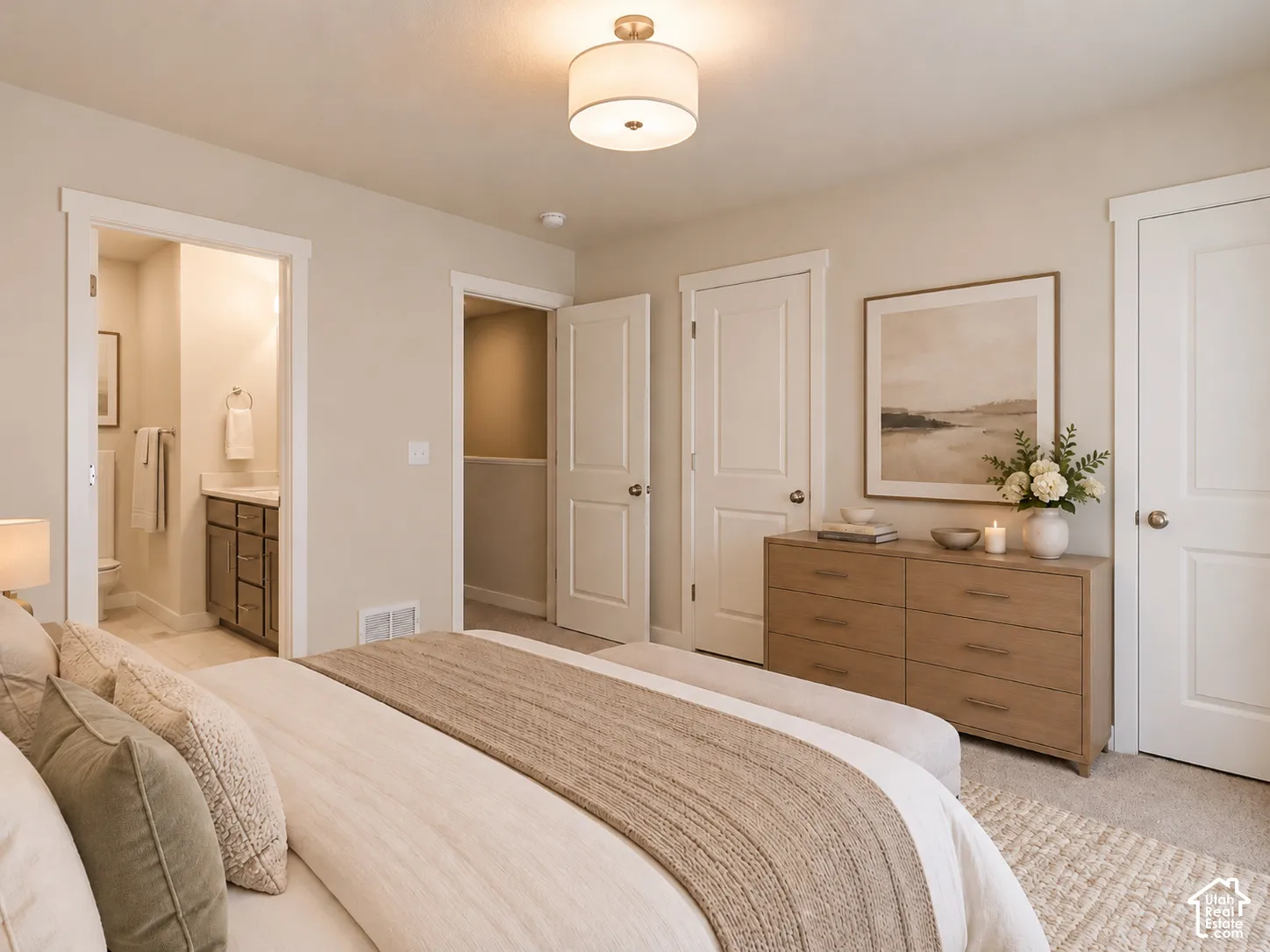 Neutral-toned interior featuring two-panel interior doors, a semi-flush mount drum light fixture, and carpeted flooring