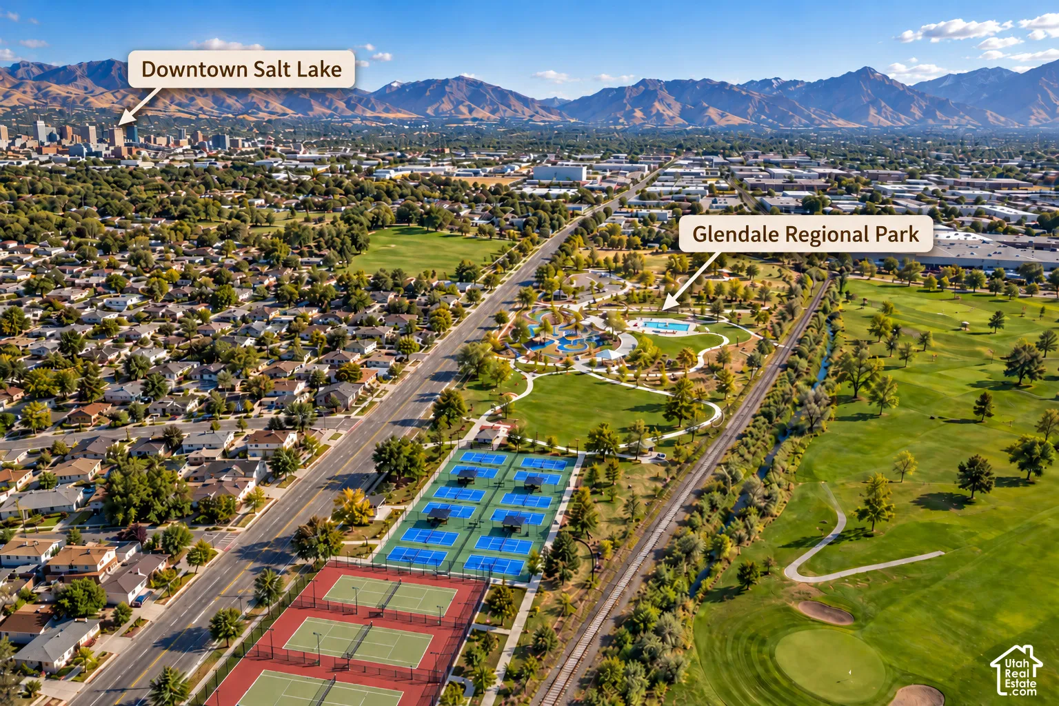 Aerial perspective showcasing proximity to mountain backdrops, downtown Salt Lake, and expansive green space including tennis courts and regional parkland