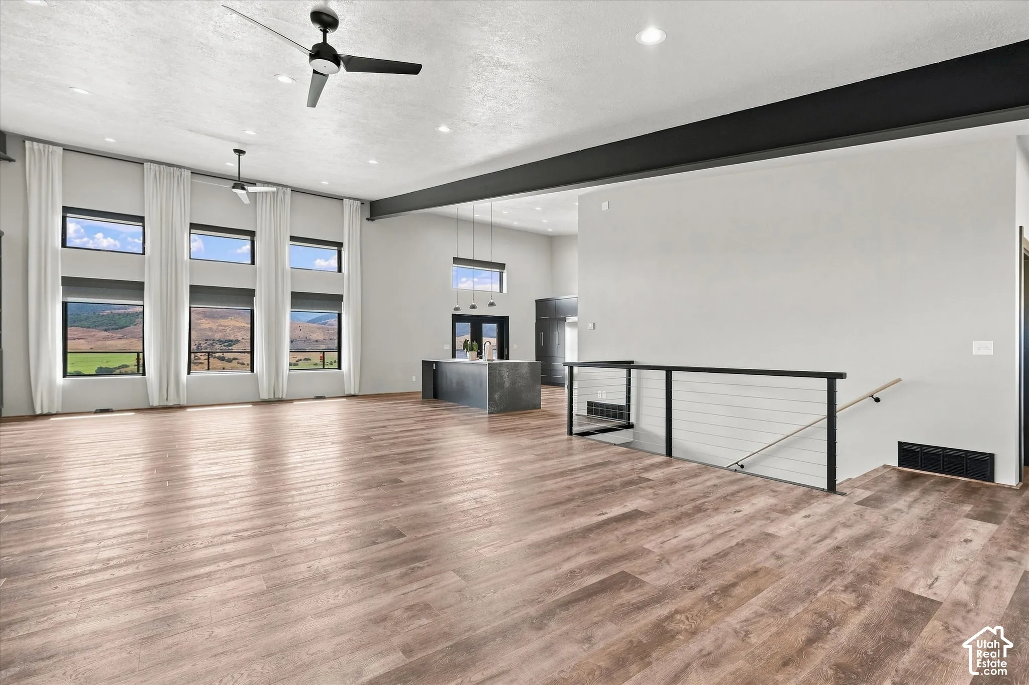 High ceilings featuring recessed lighting and ceiling fans