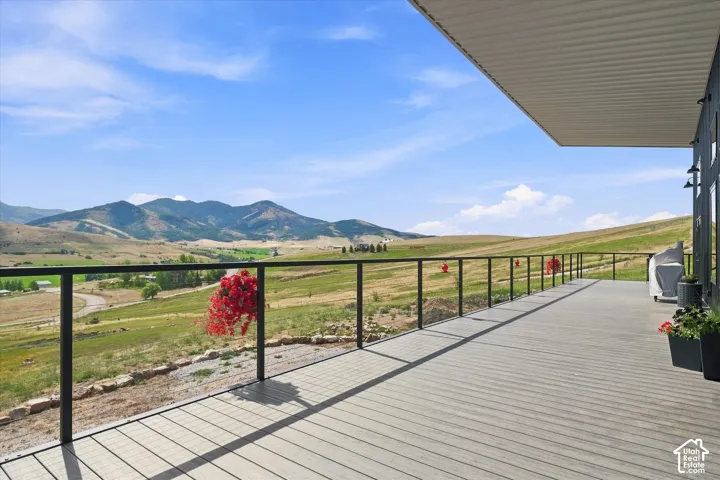 Expansive outdoor deck with composite decking and glass railing