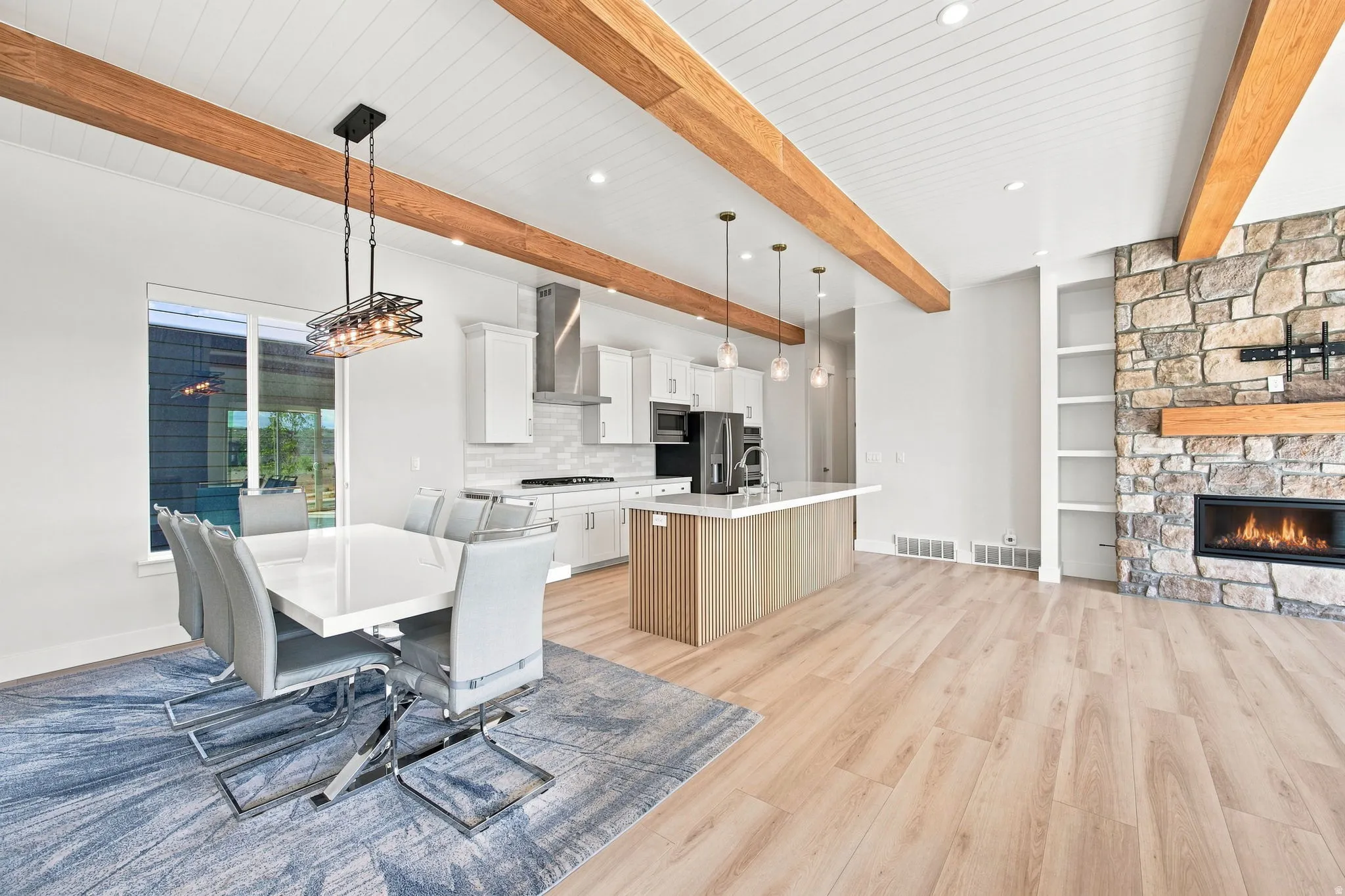 Exposed wood beams and shiplap ceiling