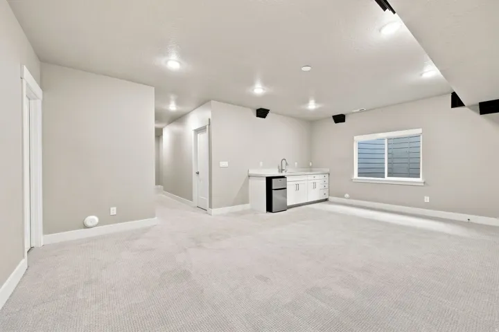 Recessed lighting and carpeted flooring throughout