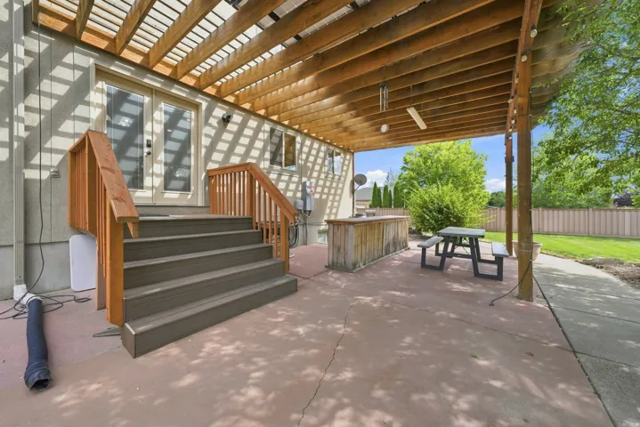 Spacious patio with a wood pergola