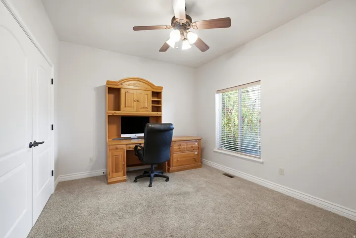Ceiling fan, window with blinds, carpeted flooring, and white trim