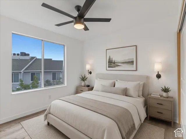 Recessed lighting, wood-finish flooring, and a contemporary ceiling fan with integrated lighting