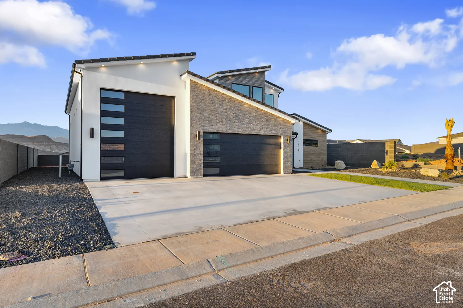 Contemporary exterior featuring a stone accent fa