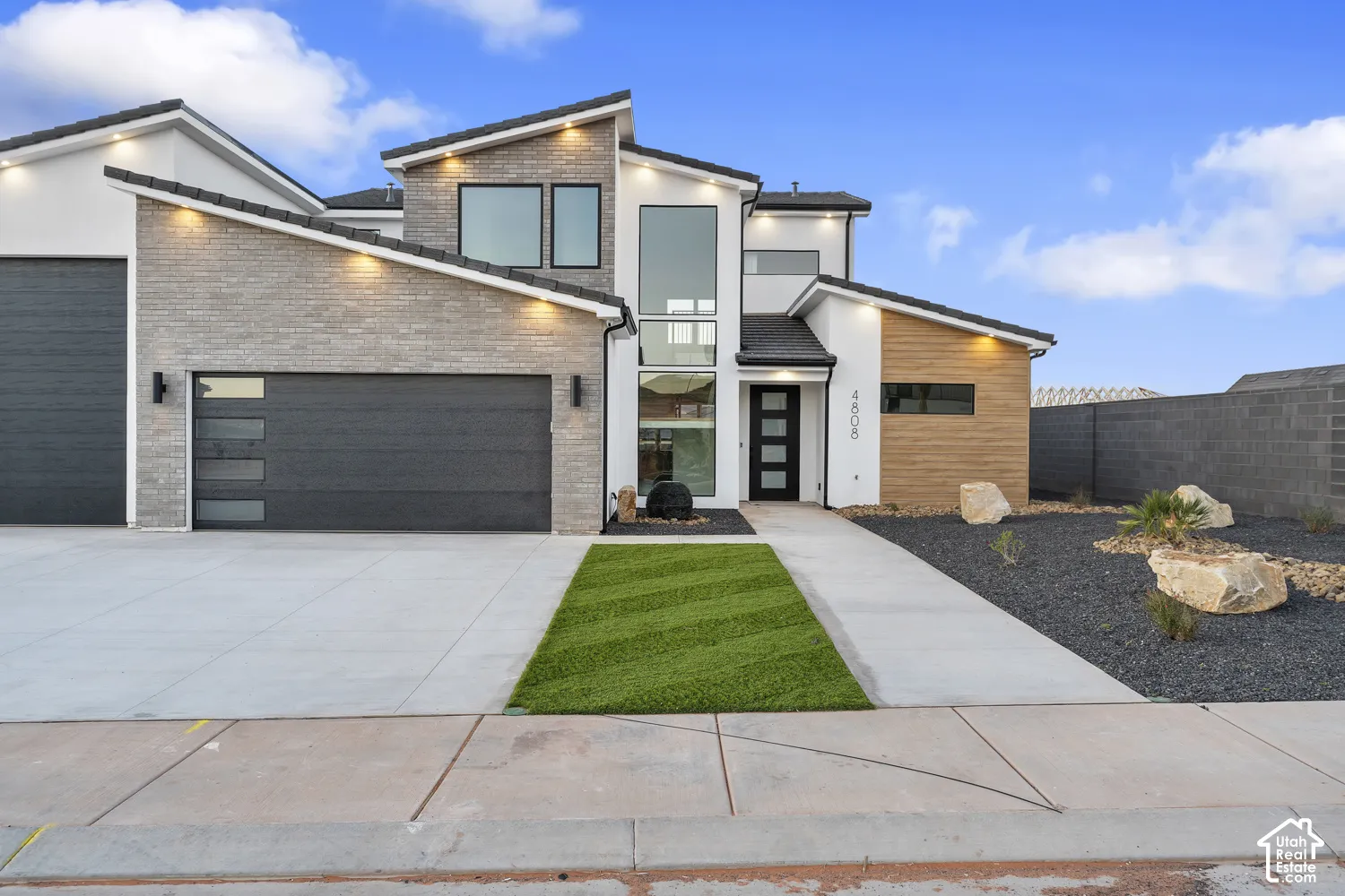 Contemporary architectural design with white stucco and light gray brick accents