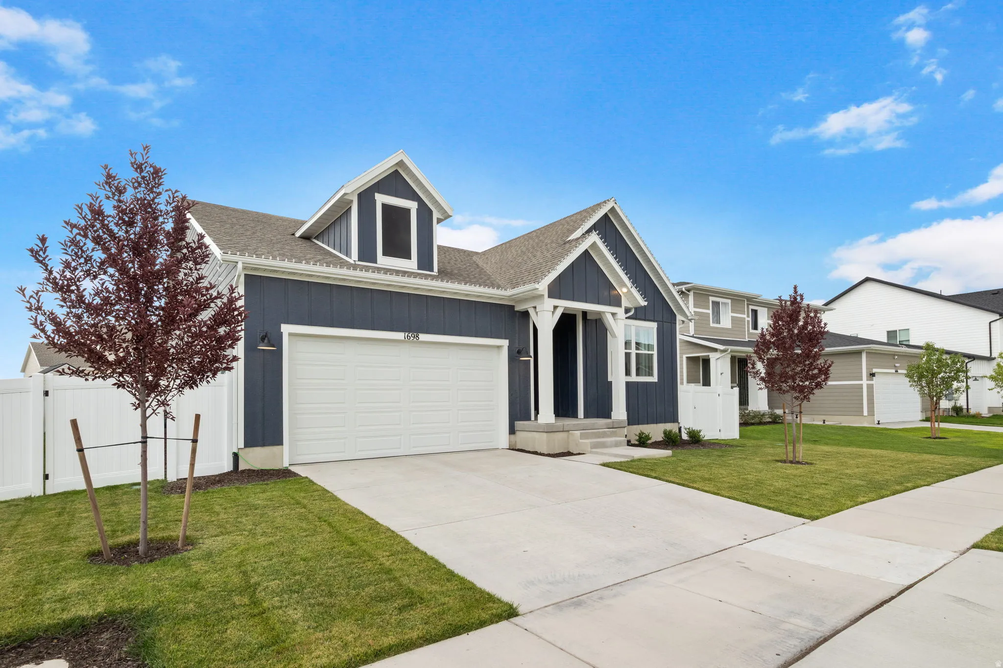 Like new home featuring long driveway blue siding and white trim