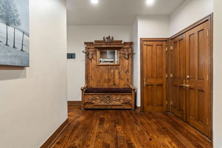 Warm wood-finish flooring complemented by solid wood doors