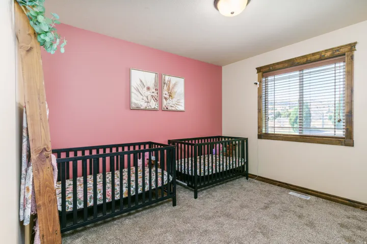 Wall-to-wall carpeting and a ceiling-mounted light fixture