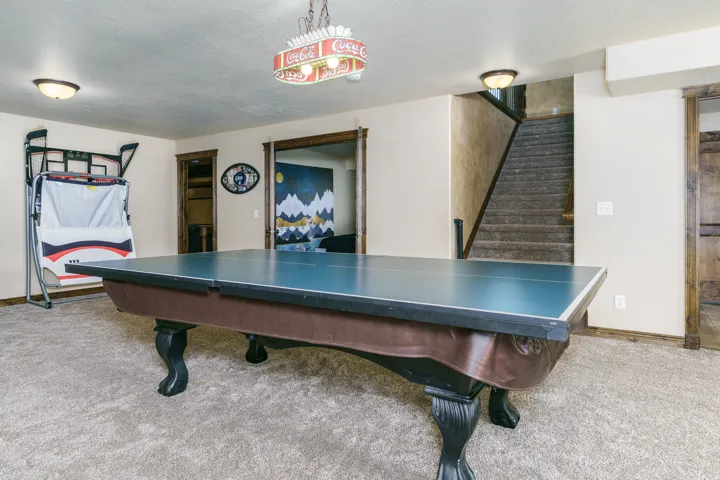 Carpeted flooring, recessed lighting, and wood-trimmed doorways