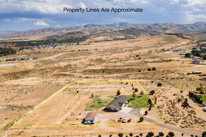 Expansive acreage with a single-story residence and detached outbuilding