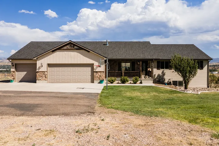 Ranch-style residence featuring a combination of siding and stone veneer