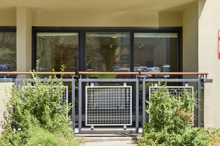Exterior patio with slider access. Gate to access slopes across the street