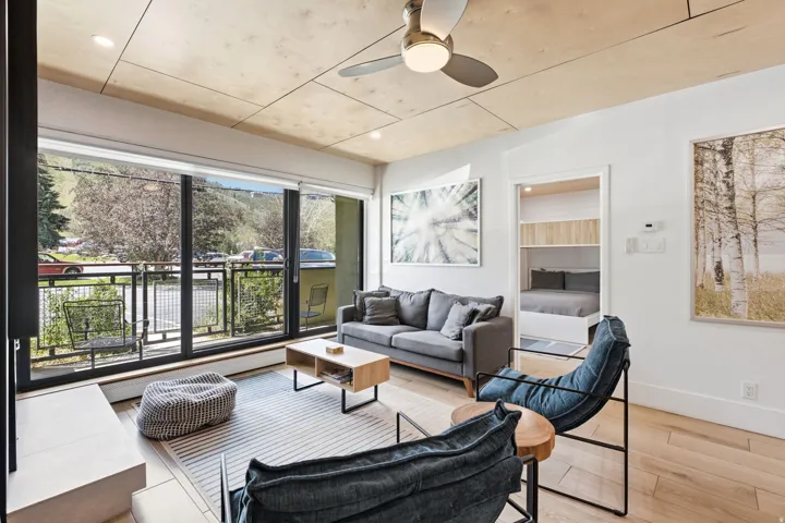 Wood-finish ceiling with recessed lighting and ceiling fan