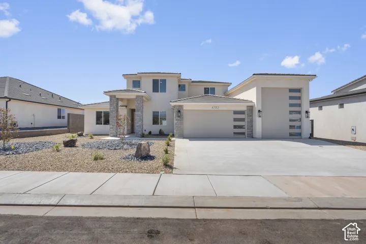 Contemporary stucco exterior with stone accents