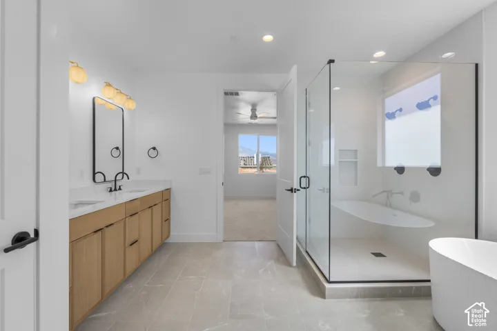 Dual vanity with wood-finish cabinetry and undermount sinks